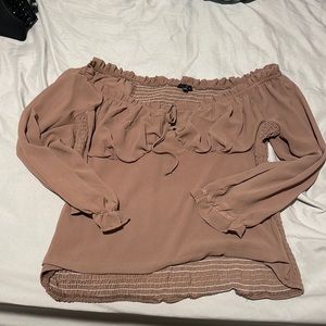 Light purple blouse with ties in front.